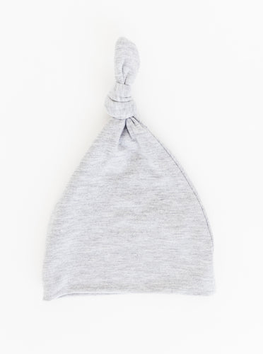 our bamboo top knot hat for babies in our heathered grey colour available in size 0-3 months