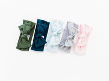 Load image into Gallery viewer, our collection of bamboo baby headbands that come in one size 0-12 months