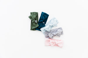 our collection of headbands in five colours includes our moss green, midnight teal, baby blue stripe, heathered grey and light pink