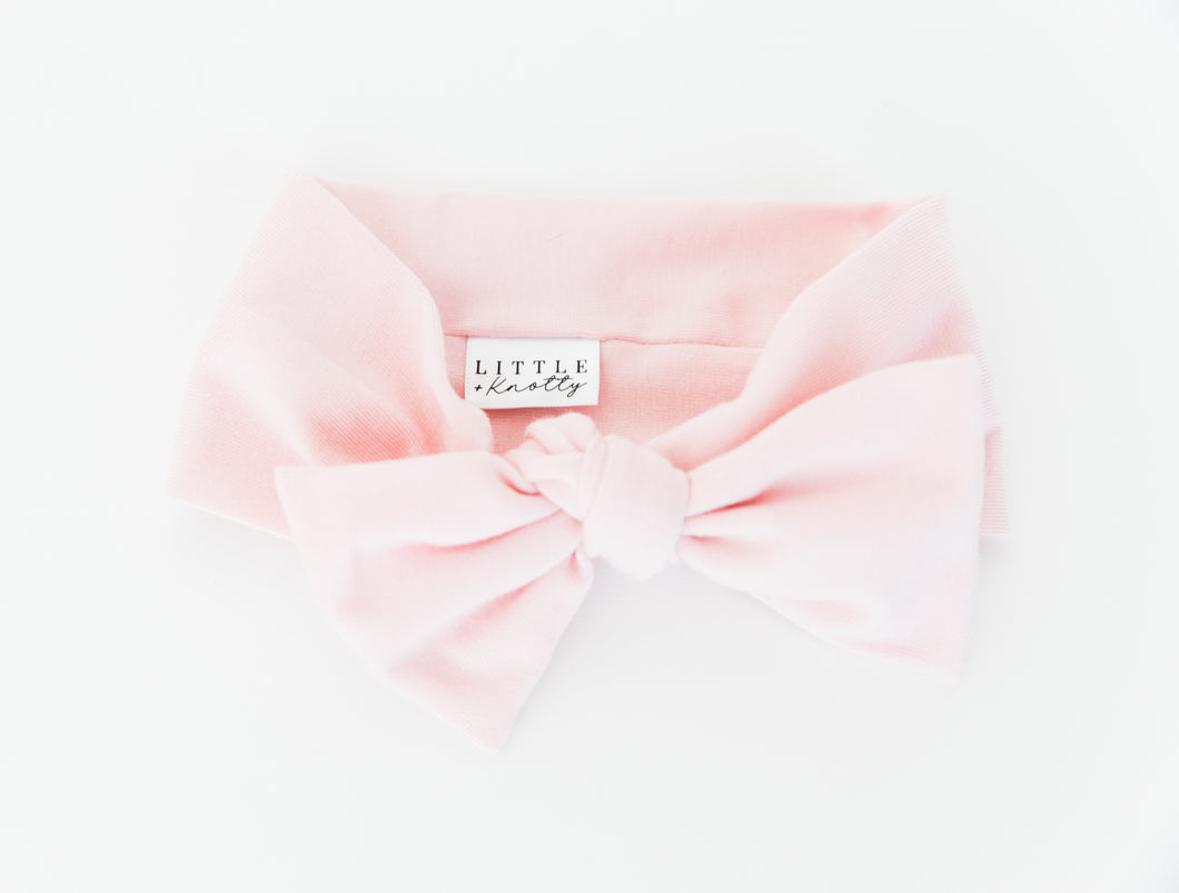 our bamboo stretch baby headband in light pink