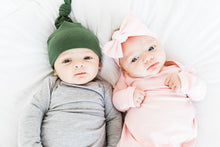 Load image into Gallery viewer, baby boy and girl wearing our knotted gowns and baby girl is wearing our headband in light pink paired with our light pink knotted gown