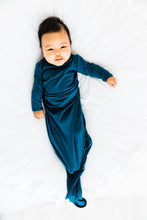 Load image into Gallery viewer, baby wearing our knotted baby gown in midnight teal