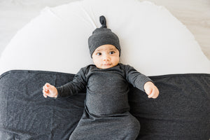 baby hat, gown and swaddle blanket in charcoal grey