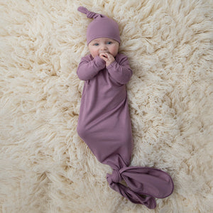 mauve knotted gown and hat