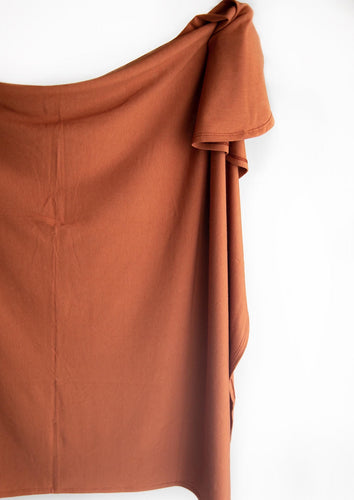 Swaddle Blanket in the colour rust